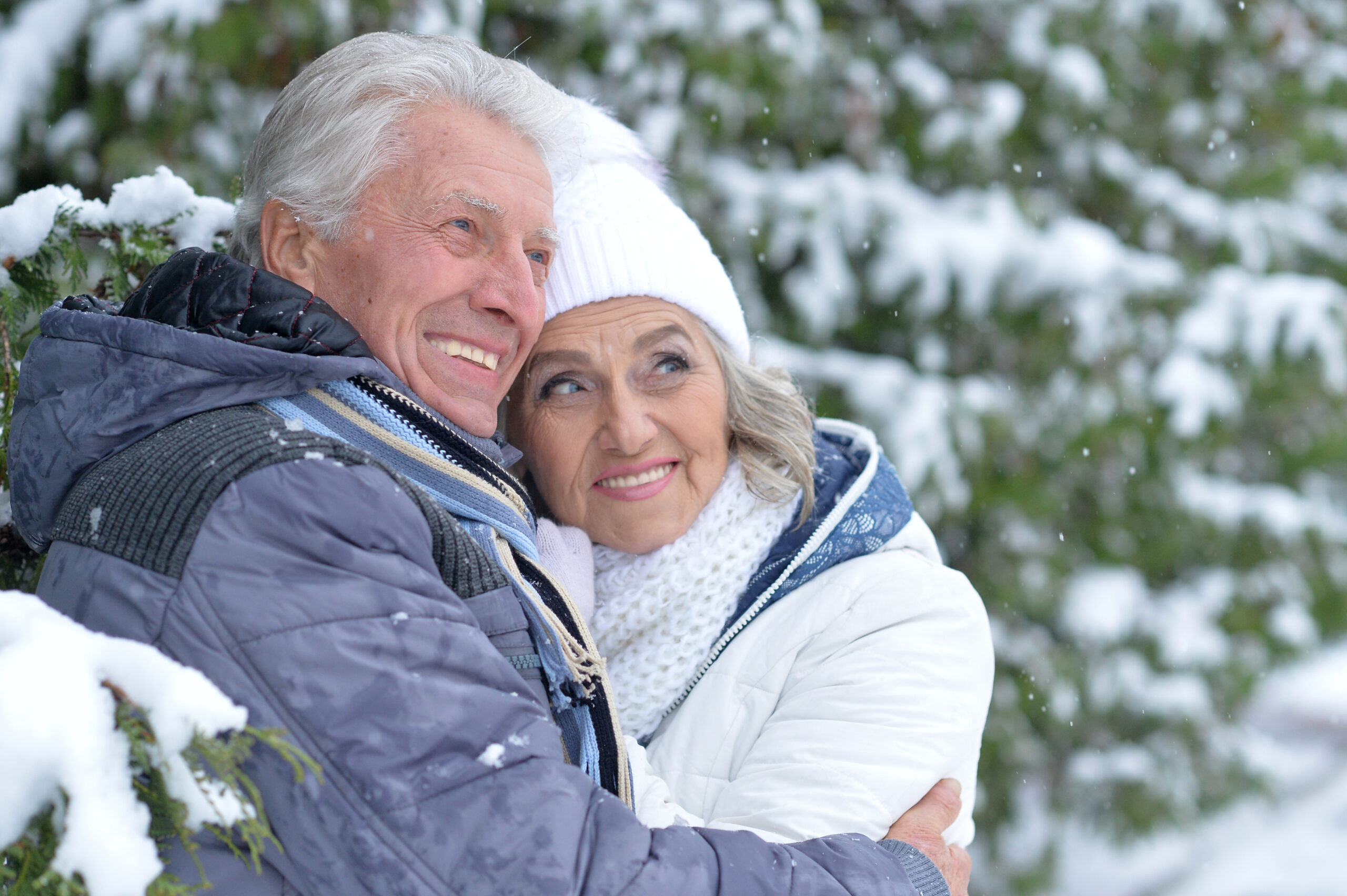 Happy mature couple enjoying the winter scenery in Angel Fire, New Mexico.